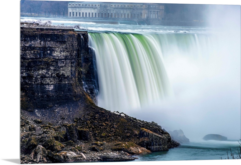 View of Horseshoe Falls at Niagara Falls with former Toronto power generating station in the background.