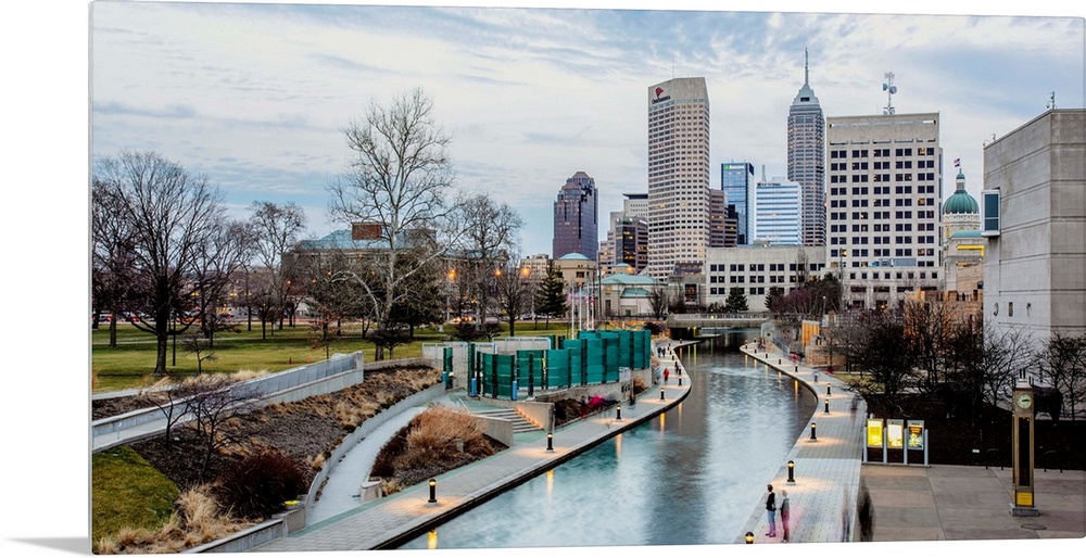 Photo of the Indianapolis city skyline reflecting onto the Indiana Central Canal.