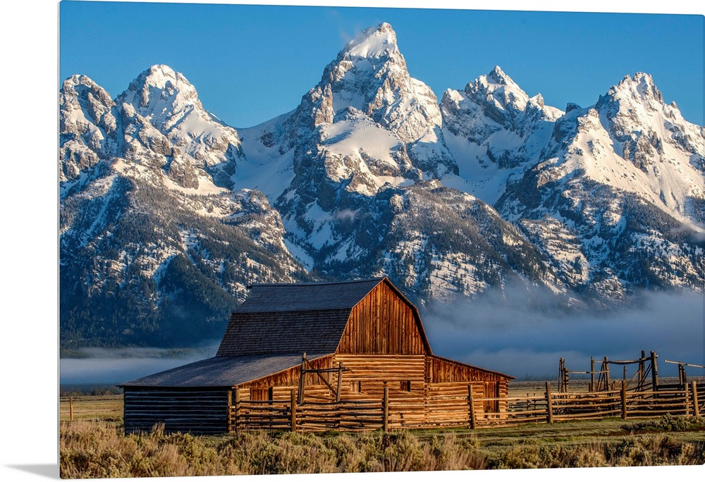 View of the John Moulton Barn with Middle Teton, Grand Teton and Mount Owen in the background. Grand Teton National Park, ...