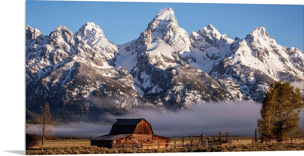 View of the John Moulton Barn with Middle Teton, Grand Teton and Mount Owen in the background. Grand Teton National Park, ...