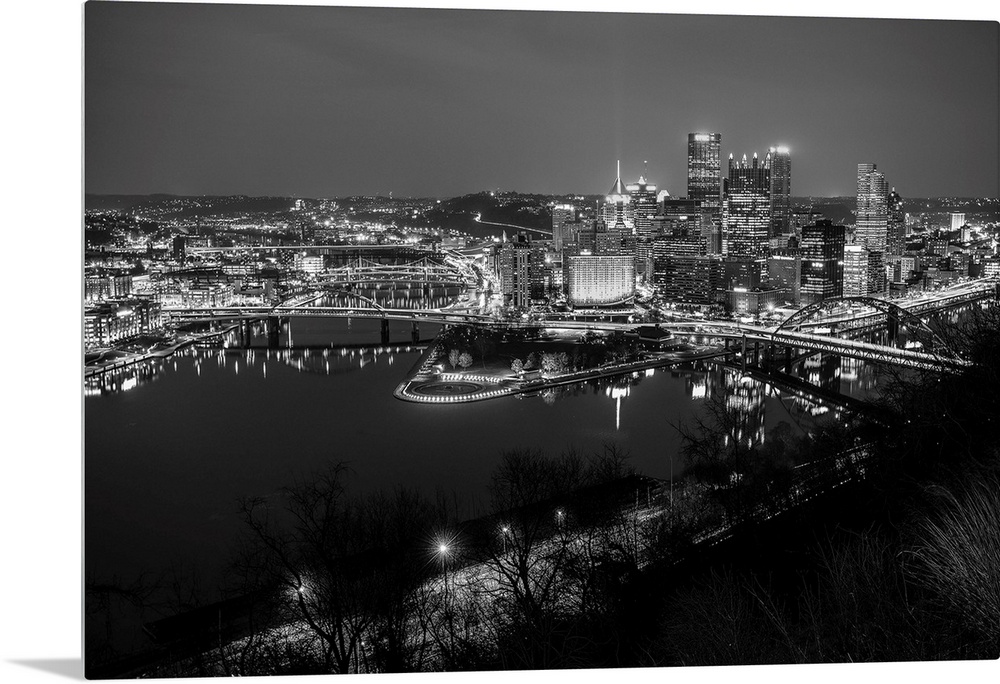 Photo of downtown Pittsburgh at night with Point State park.