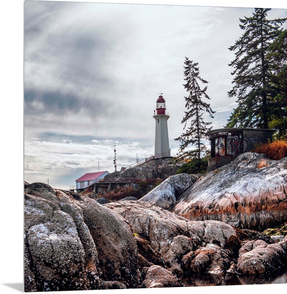 View of Point Atkinson Lighthouse and rocky shore in Vancouver, British Columbia, Canada.