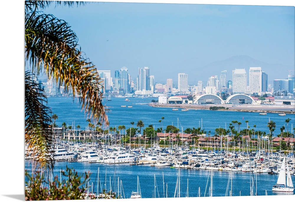 Panoramic photograph of the San Diego, California skyline with a marina in the foreground packed with sailboats.