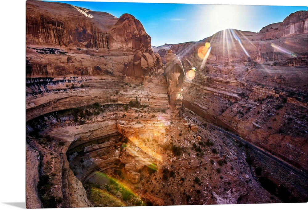 The sun shining on Shafer Canyon, Canyonlands National Park, Utah