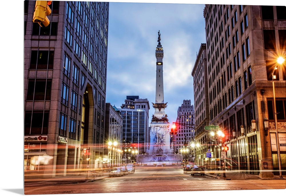 The Soldiers and Sailors Monument in the evening with lights from passing traffic in Indianapolis, Indiana.
