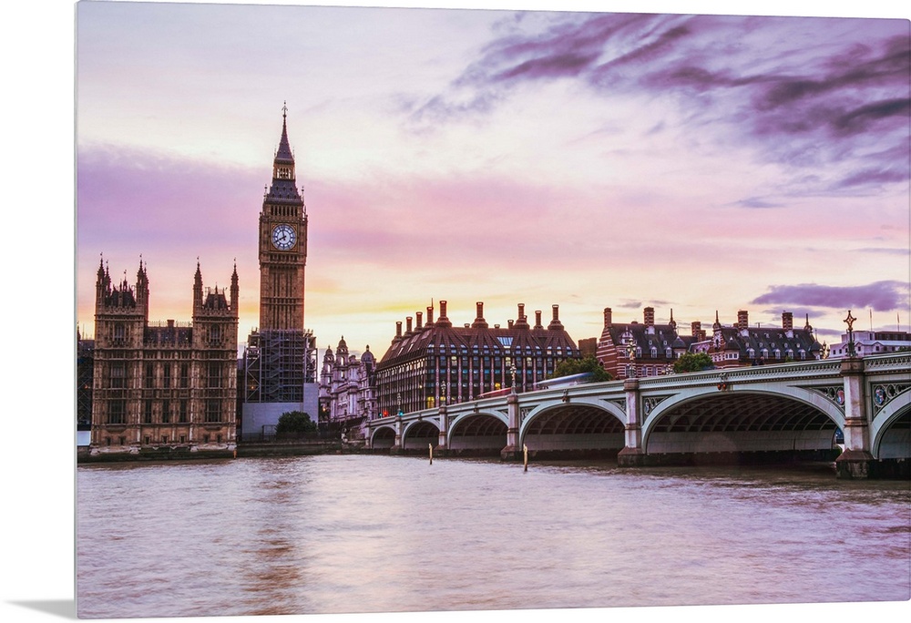 Photograph of Big Ben and the Westminster Bridge with a pink and purple sunset.