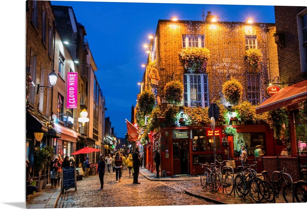 Photograph of Temple Bar, a busy riverside neighborhood in Dublin, Ireland, at night.