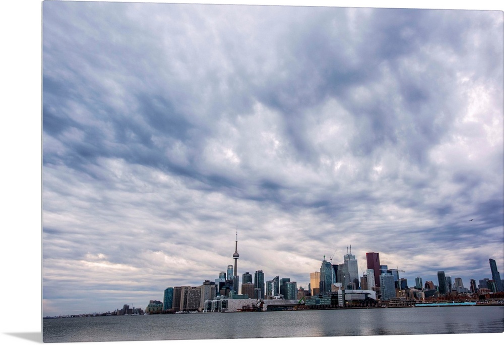 Toronto city skyline under dramatic clouds, Ontario, Canada.