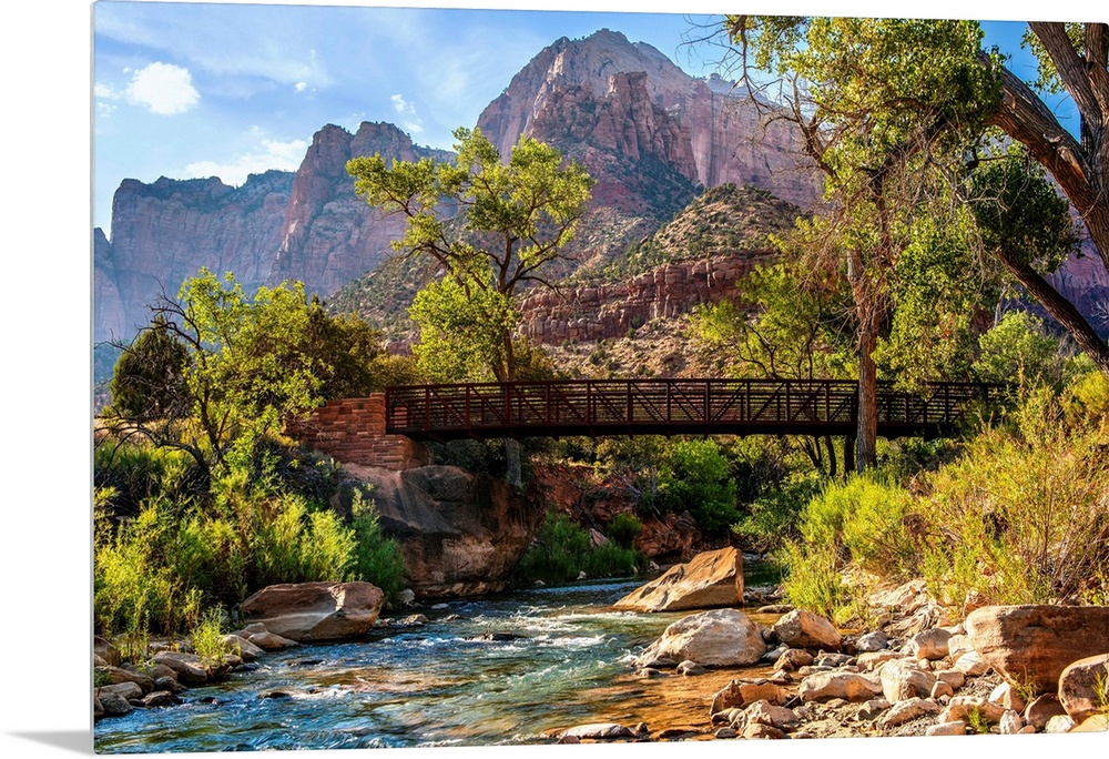 Landscape photograph of a pedestrian bridge over the Virgin River at Zion National Park, UT.