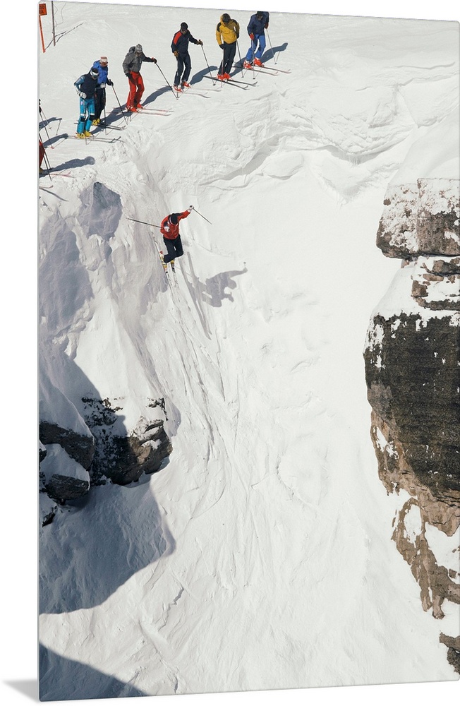 Skilled skiers plunge more than 15 feet in Corbet's Couloir.