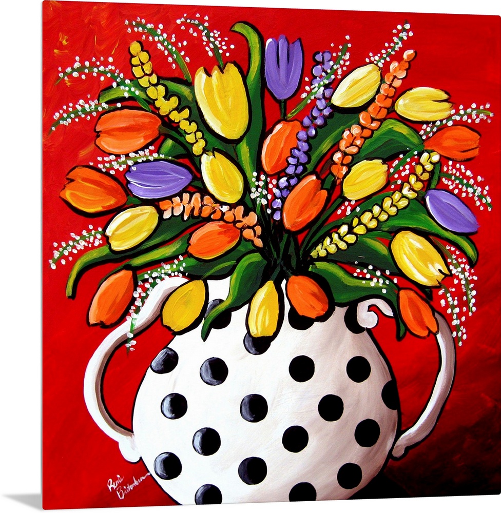 Fun, brightly colored polka dot vase filled with spring flowers and Tulips.