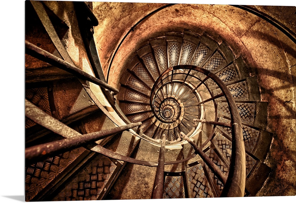 Photograph of a vintage flight of steps made of metal enclosed by brick that circles to the top of a brick column.