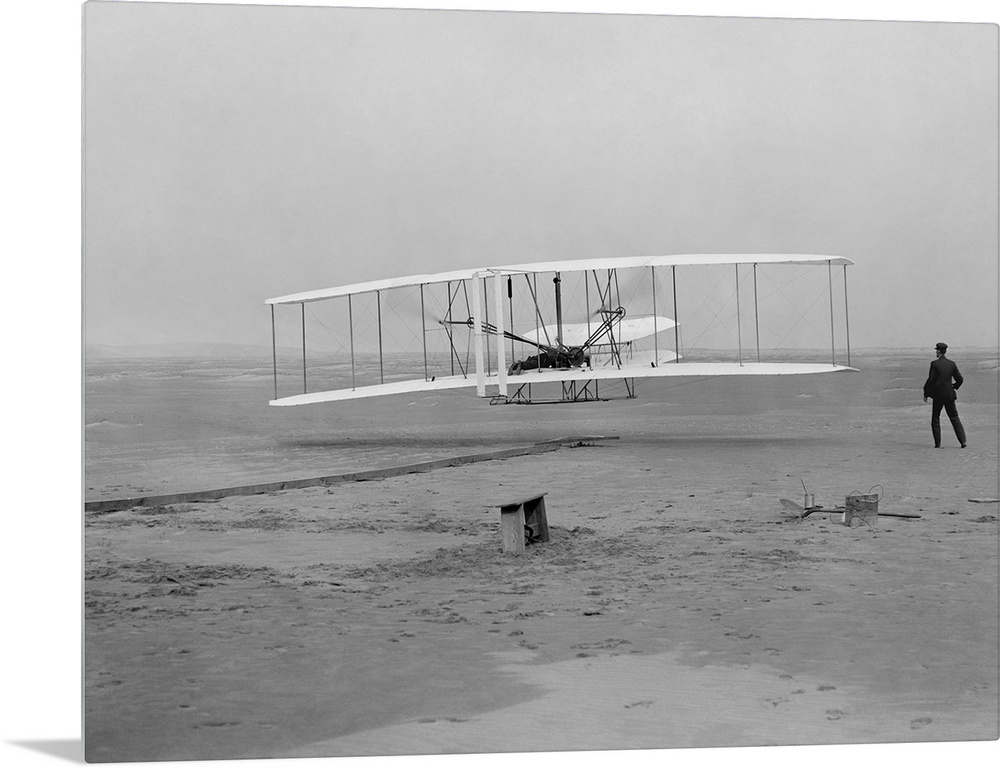 The first flight of the Wright Flyer in 1903.