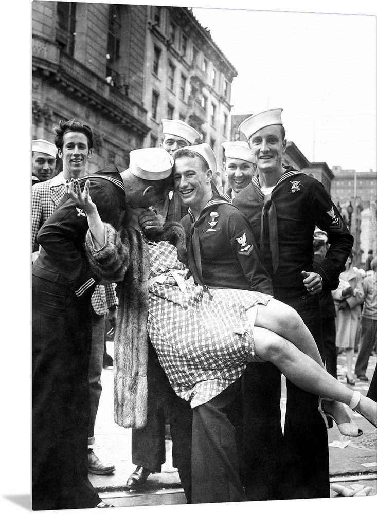 American sailors kissing and posing with a woman while celebrating the end of World War II, possibly in Times Square, New ...