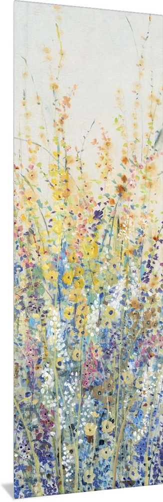 Vertical panel of blooming yellow and blue wildflowers in a field.