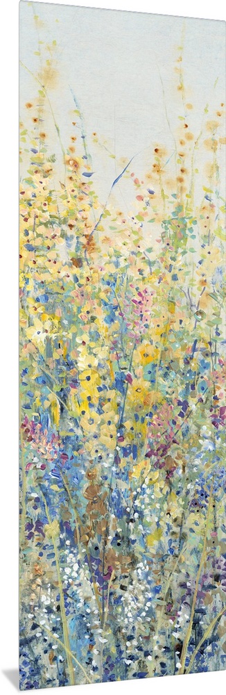 Vertical panel of blooming yellow and blue wildflowers in a field.