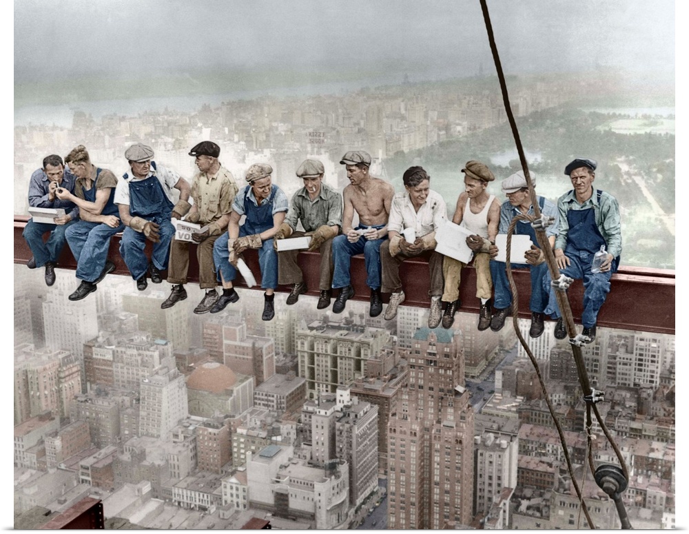 29 Sep 1932, Manhattan, New York City, New York State, USA --- Construction workers eat their lunches atop a steel beam 80...