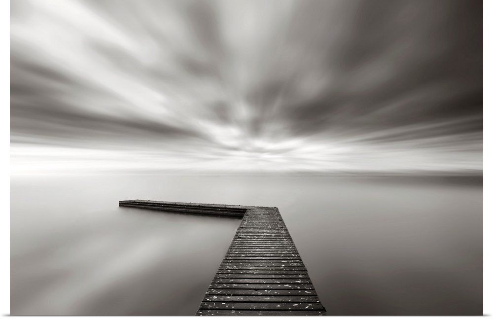 This wall art is a time lapsed photograph of this lake pier has created a sensation of motion in the sky and water which h...