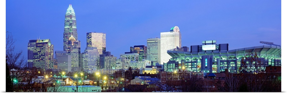 Panoramic cityscape photograph of the Queen City downtown at twilight.