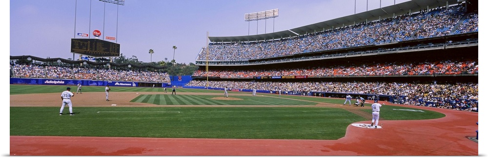 A wide angle photograph taken from the third base side in Dodgers stadium as they play the Yankees.