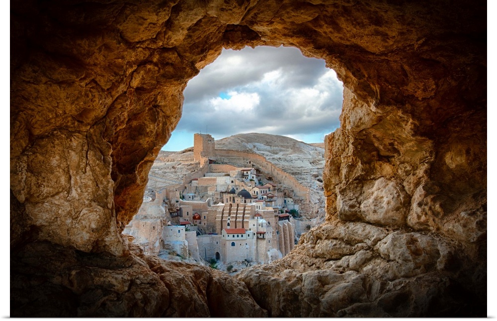View of Mar Saba Monastery in Israel from a hole in a rocky wall.