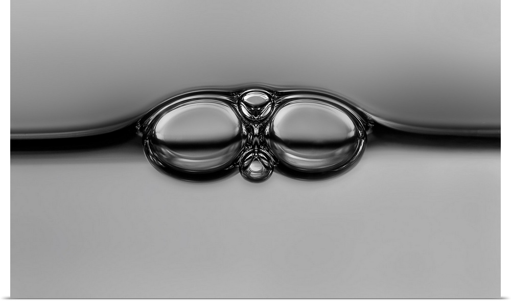 Bubbles in liquid resembling the shape of eyeglasses.