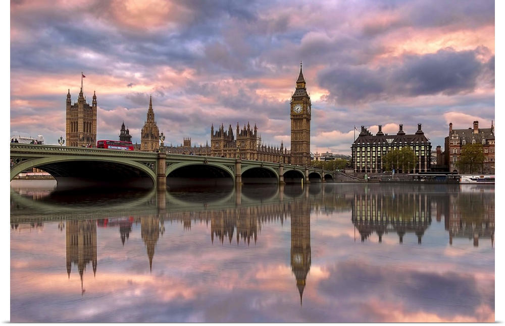 Sunset photograph of the Westminster Bridge with Big Ben and the House of Parliament in the background reflecting on to th...