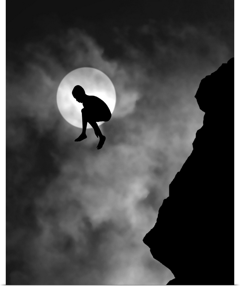 Silhouette of a person jumping off a cliff, with the moon directly behind.