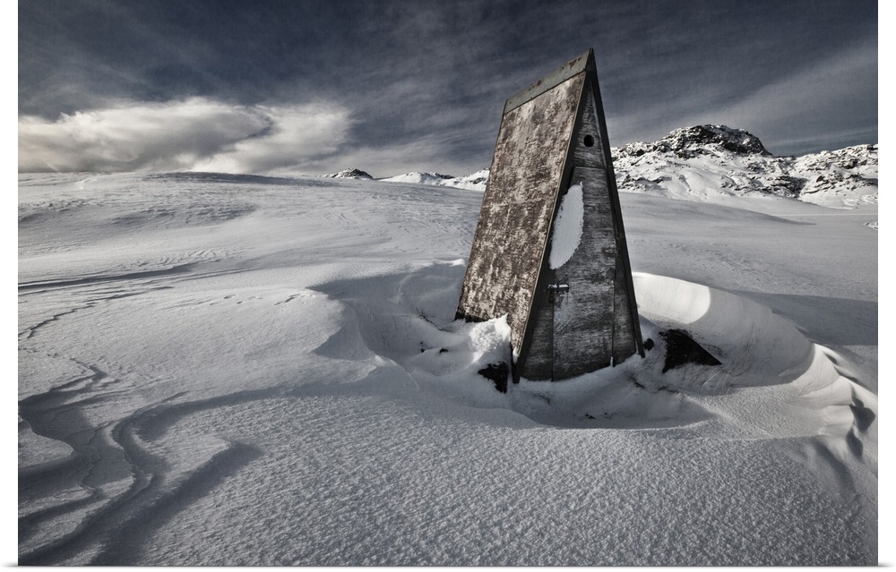 A triangular shack in the deep snow on the Reykjanes Peninsula, Iceland.