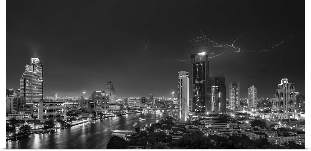 An aerial photograph of the Bangkok skyline with lightning overhead.