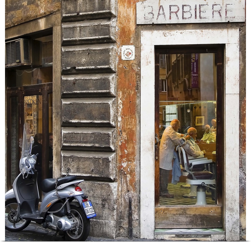A scooter outside of a barbershop in Italy.