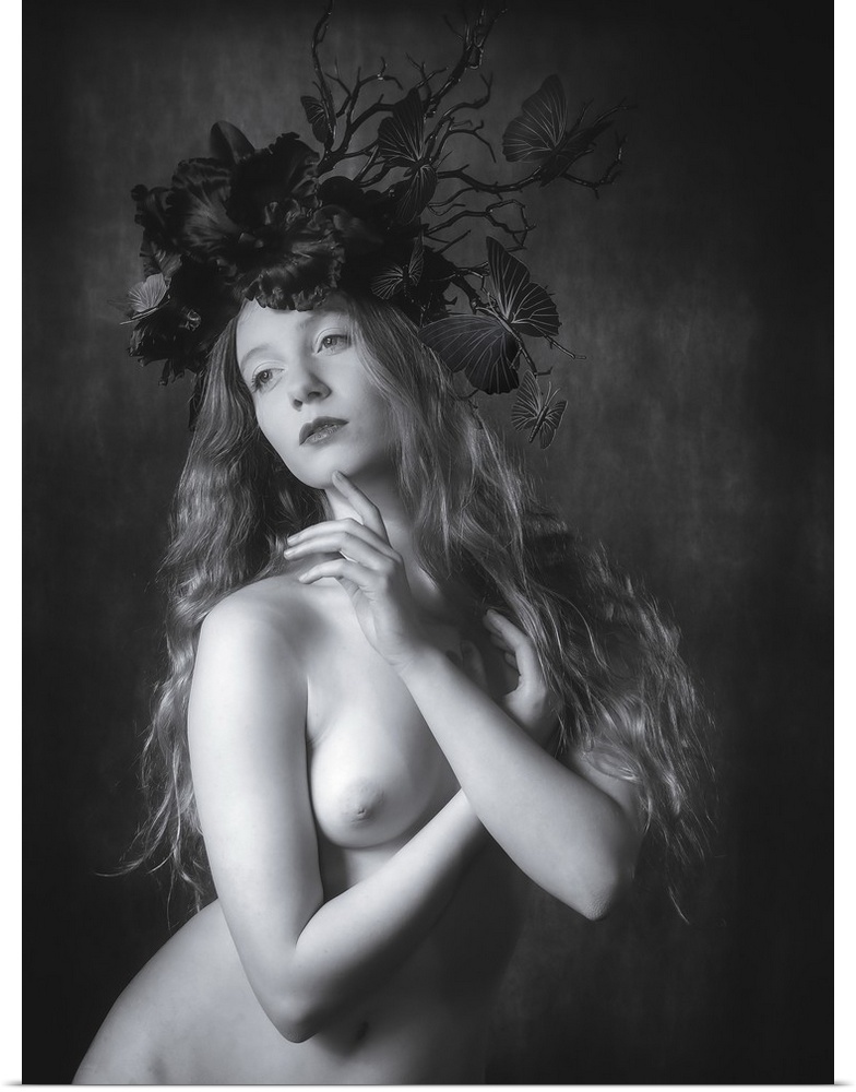 Black and white fine art portrait of a nude woman wearing a floral and butterfly headpiece.