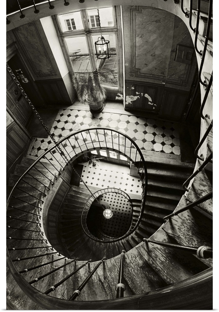 View through the center of a spiral staircase in Paris.