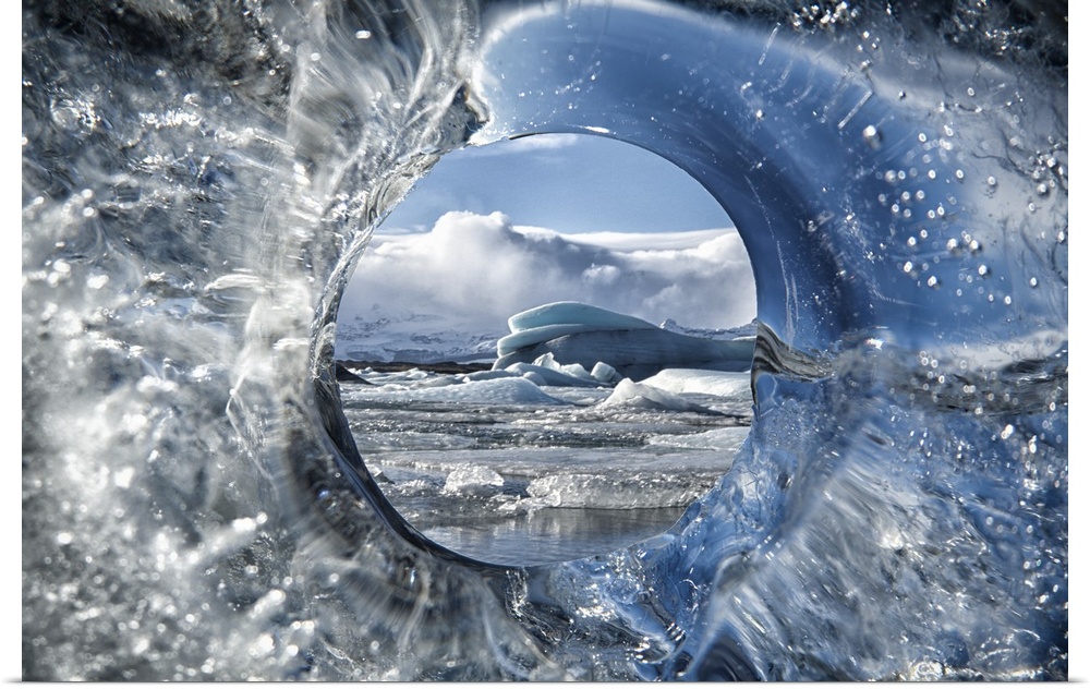 View through the hole in the ice of an iceberg, Iceland.