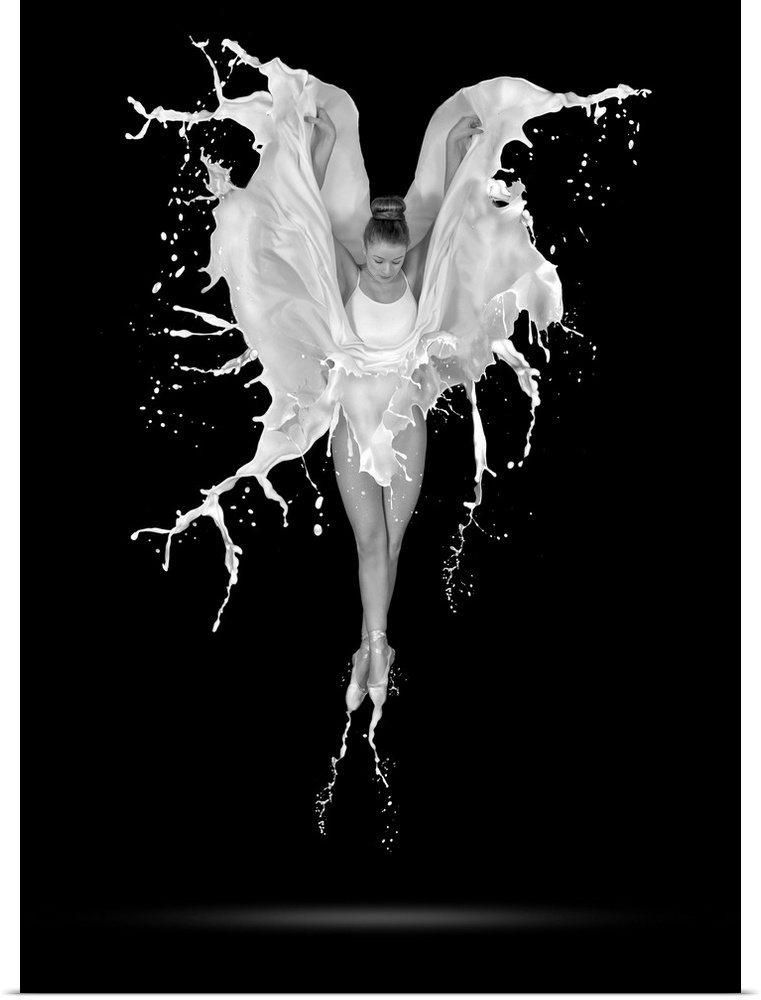 A black and white photograph of a ballerina in the air with her skirt flowing around in the form of liquid.