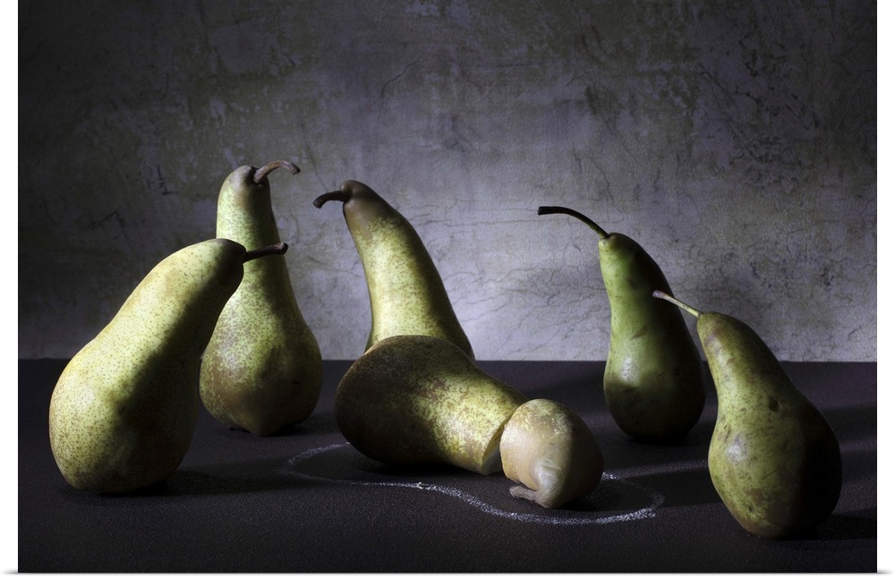 Conceptual image of a group of pears appearing concerned over a sliced pear on the ground.