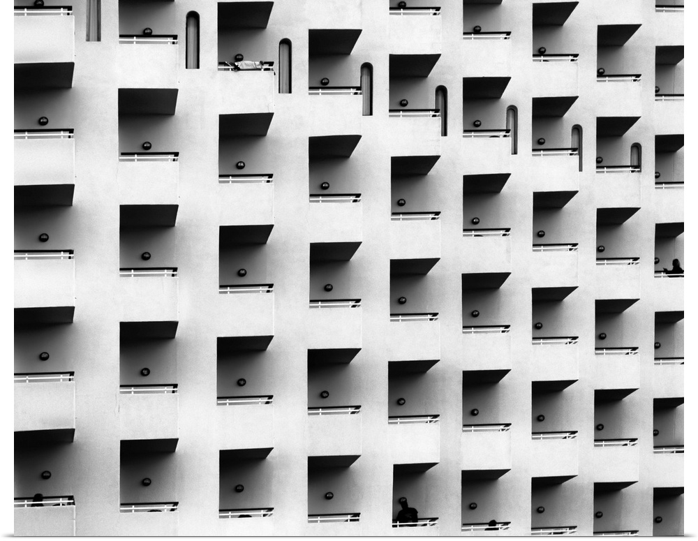 Black and white architectural abstract photograph of a facade full of balconies.