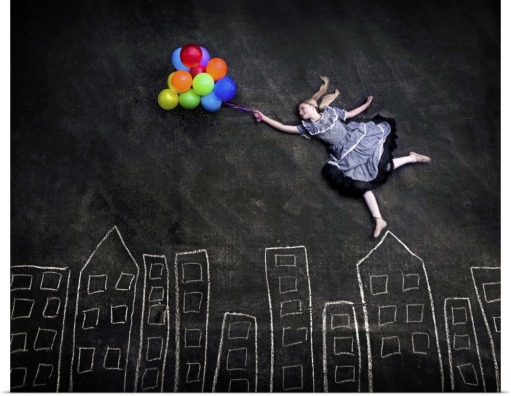 Conceptual image of a girl holding a bunch of colorful balloons appearing to float over a simple chalk skyline.