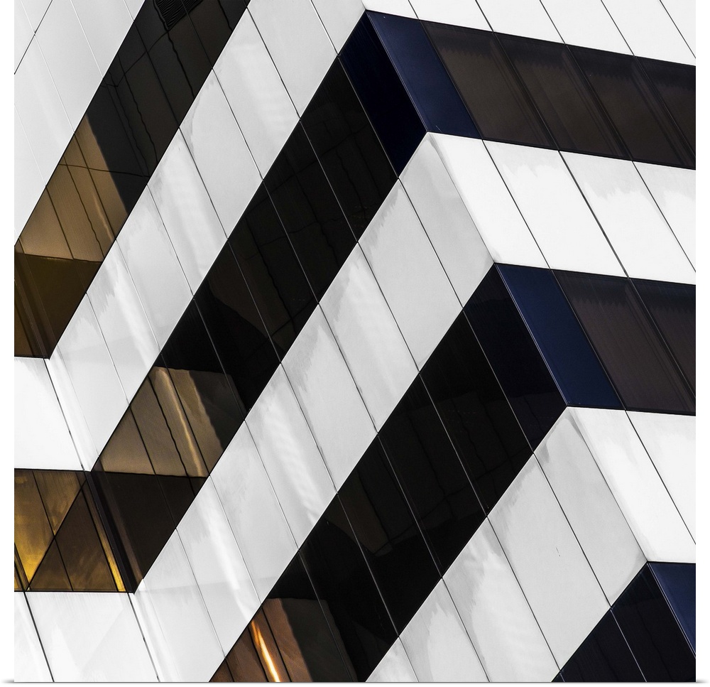Square fine art photograph of part of a black and white striped building facade.