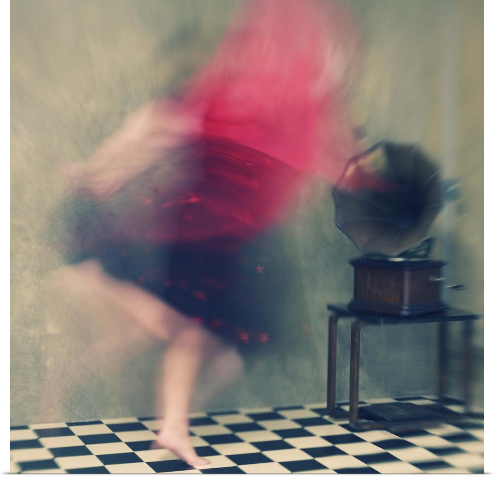 Blurred motion image of a woman in red dancing to music from a phonograph.