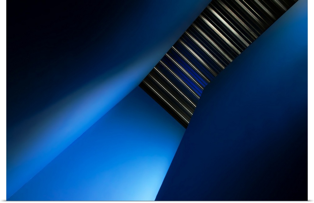 A stairwell in a hallway with blue walls.