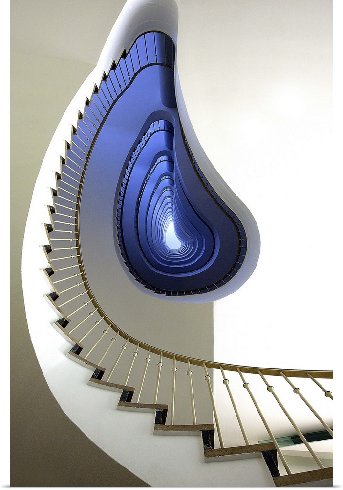 View from the ground of an oddly-shaped spiral staircase, with a blue glow.