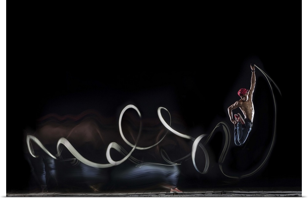 A conceptual photograph with multiple exposures of a dancer leaping into the air.