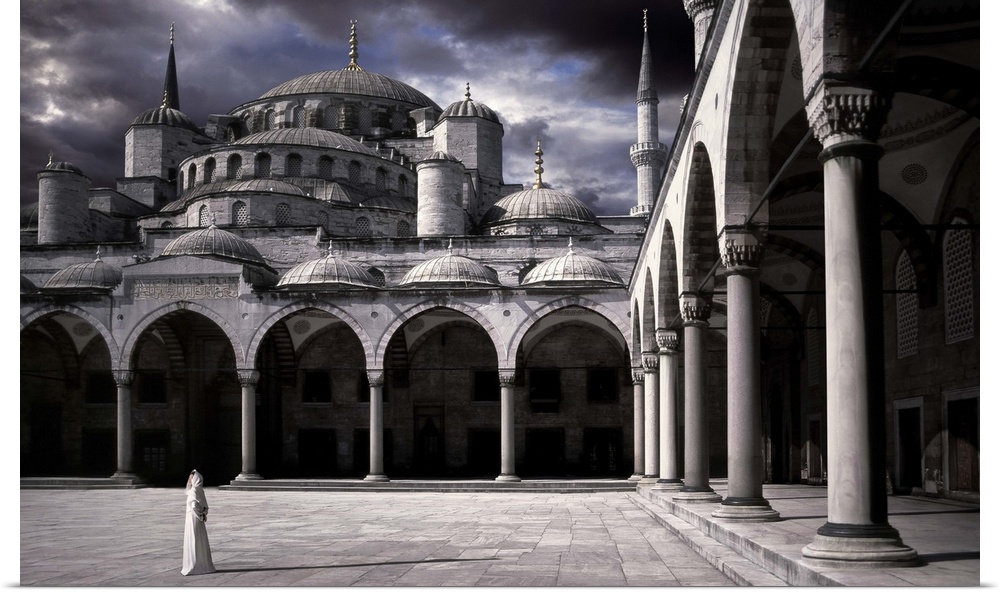 A woman in the courtyard of the Blue Mosque in Istanbul.