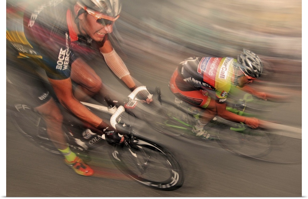 Action shot of cyclist racing at full speed.