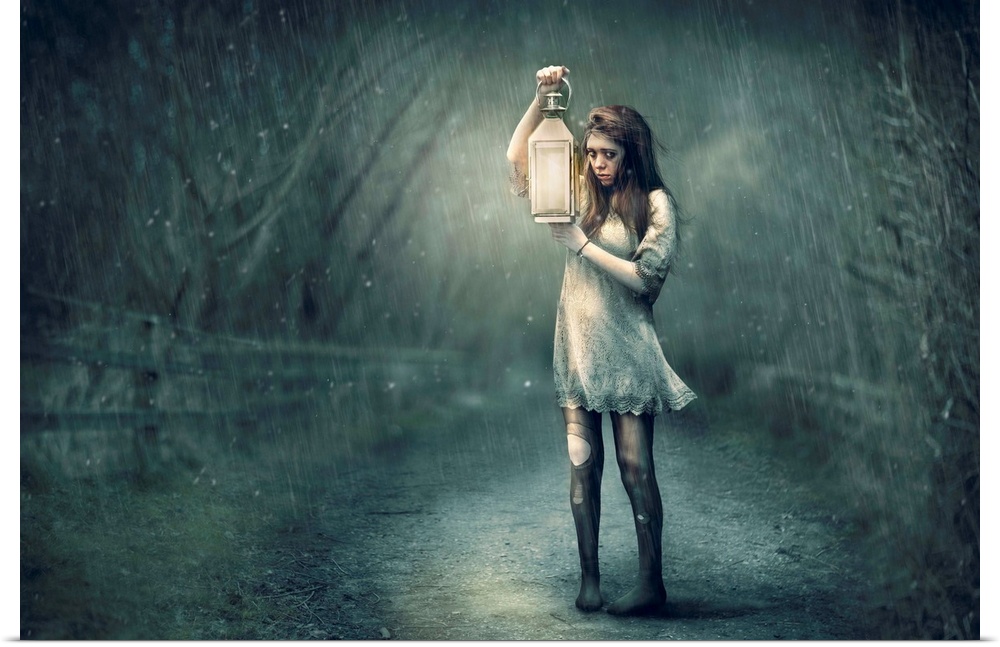 A conceptual photograph of woman in tattered clothing holding a lantern in the rain.