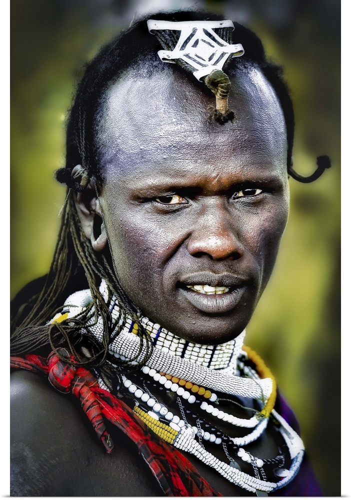 A man wearing decorative jewelry and headpieces in the Masai Mara area of Tanzania.