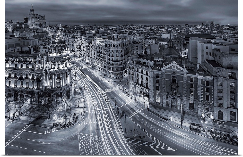 A photograph of Madrid with light trails covering the roads, Spain.