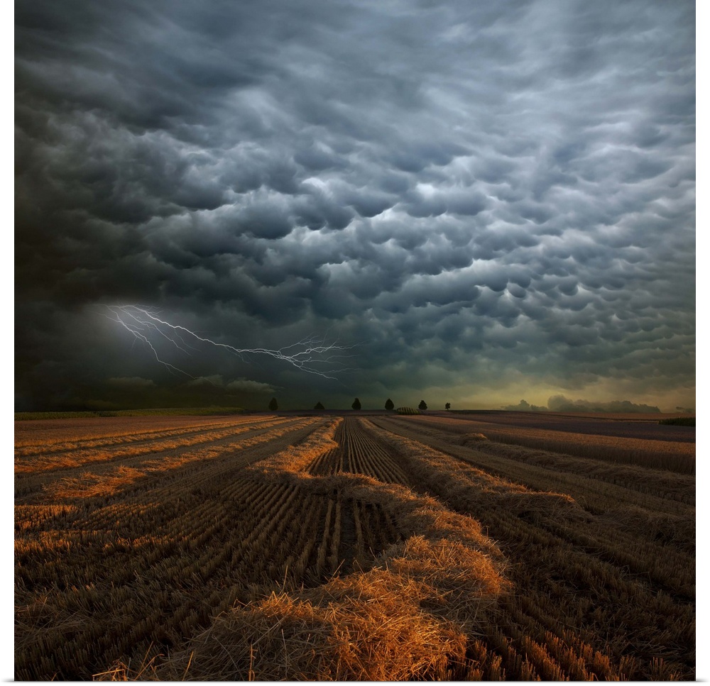 Strange storm cloud formations and lightning over farmland in Strohgaeu, Germany.