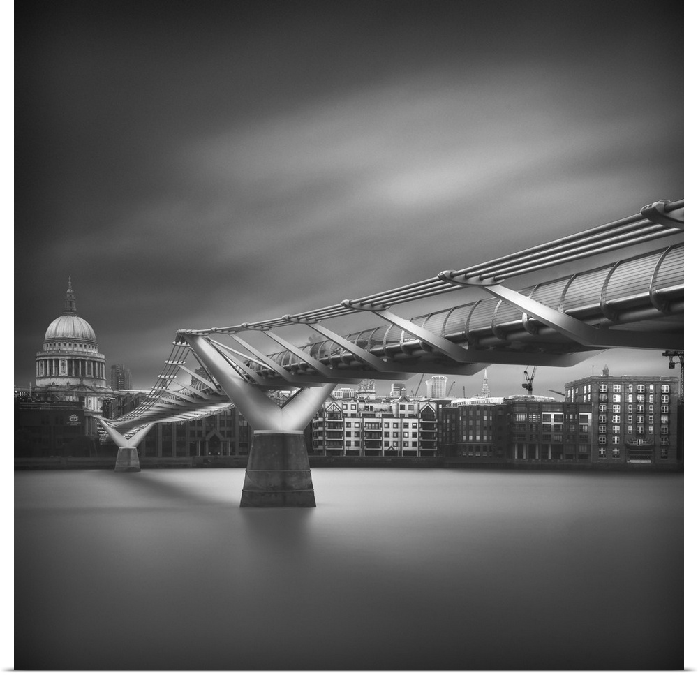 Square black and white photograph of the Millennium Bridge with St. Paul's Cathedral in the background.